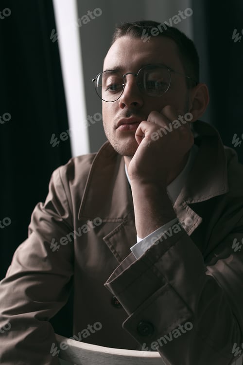 Preview: A Lonely Handsome Guy In A Raincoat And Glasses With Different Moods