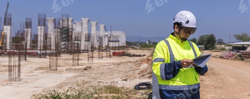 Preview: Asian engineer working at site of a large building project. Engineering,