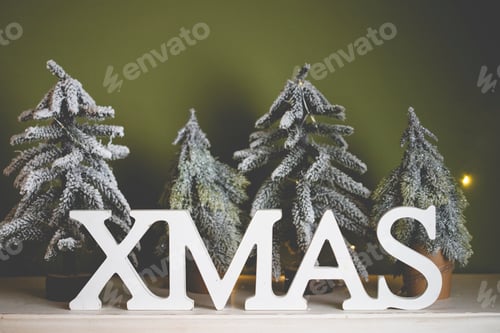 Preview: Christmas holiday background. Xmas word and mini Christmas trees