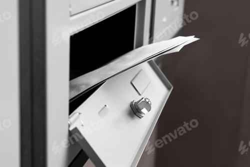 Preview: Open metal mailbox with envelopes indoors, closeup view