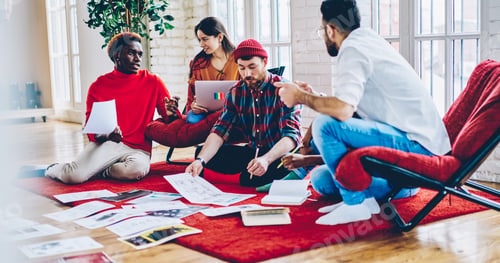 Preview: diverse group of creative graphic designers discussing ideas while analyzing paperwork in flat