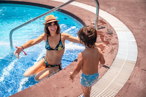 Preview: Mother and son in the pool on summer vacation, moment of love giving his mother a kiss