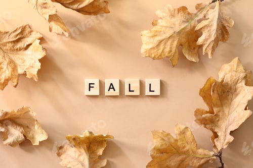 Preview: Fallen various golden oak leaves on beige background. Autumn pattern. View from above.