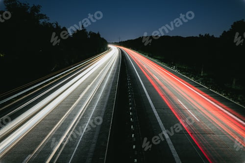 Preview: Long exposure shot of the white and red lights of the highway