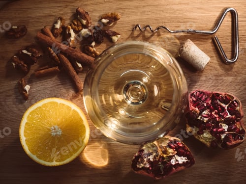 Preview: Evening still life on the table, a glass of wine and an orange