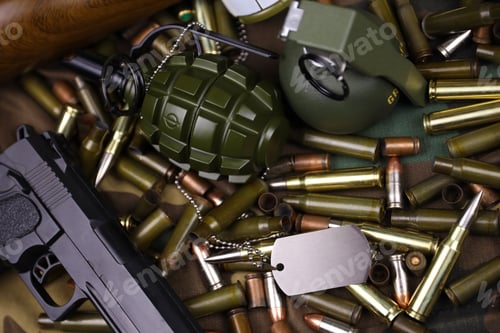 Preview: Different types of ammunition on a camouflage background. Preparing for war
