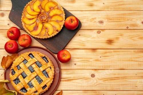 Preview: Thanksgiving berry and apple various pies on wooden surface, top view