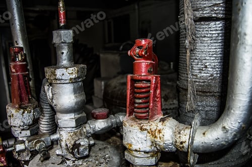 Preview: rusty pipes and taps from an old factory