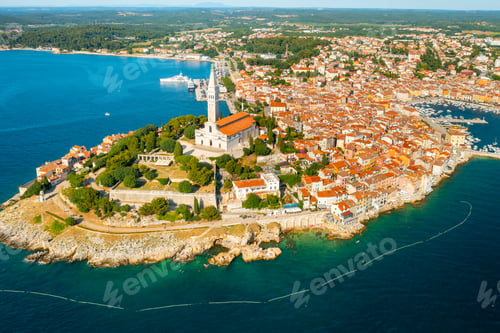 Preview: Croatian town buildings near forests and Adrianic sea at bright sunlight