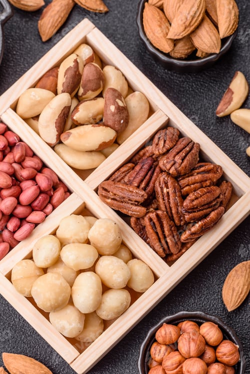 Preview: Wooden box with macadamia nuts, Brazil nuts, pecans and peanuts