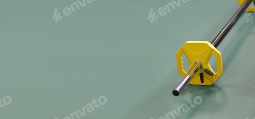 Preview: barbell on a floor in a gym. copy space. power and strength training. weight lifting
