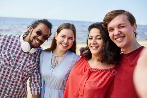 Preview: Group of Friends Posing by Sea
