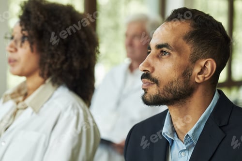 Preview: Young Middle Eastern Man Listening Attentively during Business Seminar