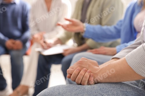 Preview: Group of people having psychotherapy session indoors, closeup