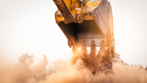 Preview: Backhoe working by digging soil at construction site bucket of crawler excavator breaking ground
