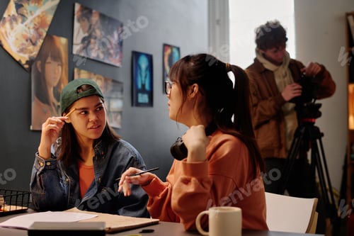 Preview: Portrait of Two Asian Women Discussing Art Project
