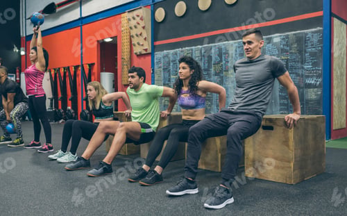 Preview: Athletes exercising doing box squats