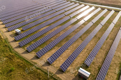 Preview: Aerial view of solar power plant. Electric panels for producing clean ecologic energy.