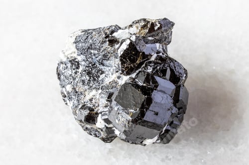Preview: raw melanite andradite black garnets on white