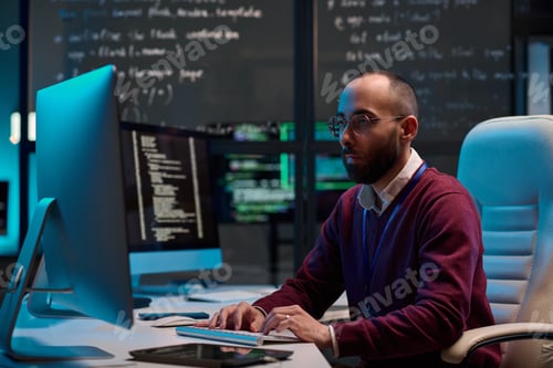Preview: Man Writing Code in IT Department