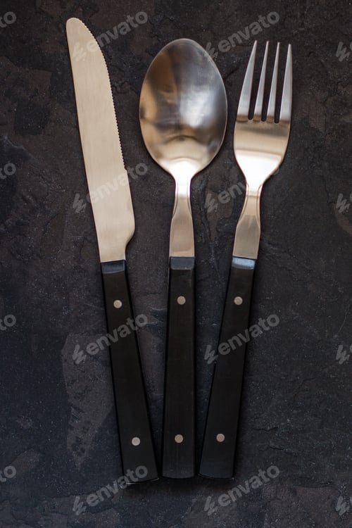 Preview: Set Of Cutlery Fork, Spoon, Knife (Vintage). Black Background. Top View . Copy Space.
