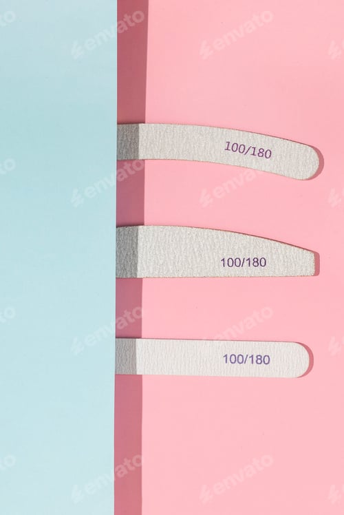 Preview: Set of gray nail files of different shapes. Tools for manicure on pastel pink and blue background.