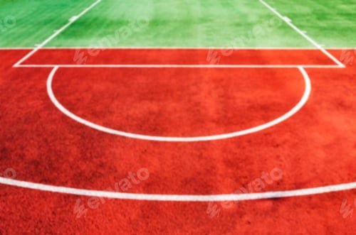 Preview: Blurred picture of an outdoor playing field.