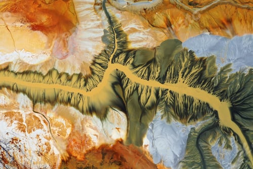 Preview: Aerial view of surreal natural patterns of gold cyanide leaching flowing into decanting lake