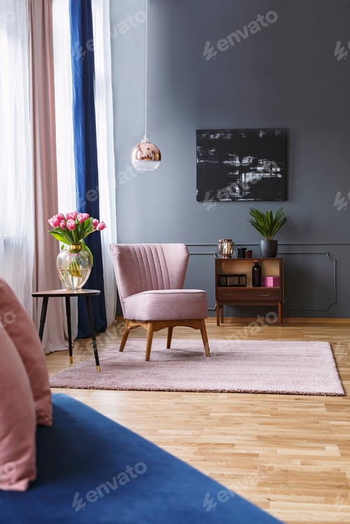 Preview: Pink chair next to table with flowers in elegant living room int