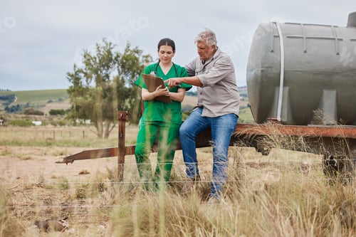 Preview: Shot of a veterinarian talking to a mature man on his farm