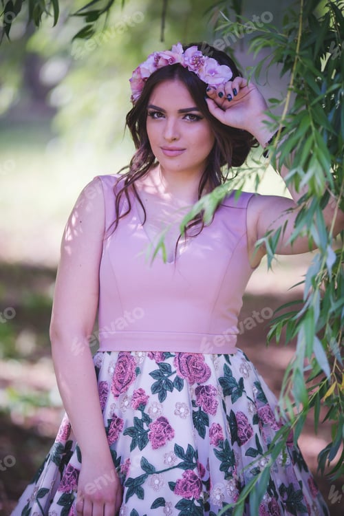 Preview: Young beautiful Caucasian female from Bosnia and Herzegovina wearing an elegant floral dress