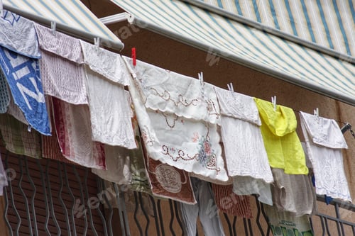 Preview: Classic clothes drying in the sun over a balcony in south Italy