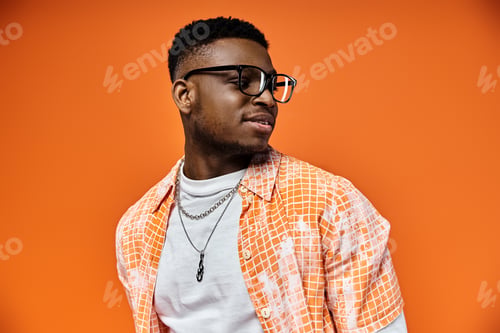 Preview: Stylish Man Embracing Vibrant Orange Aura