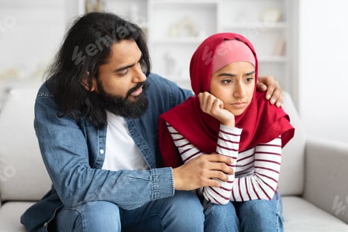Preview: Caring Arab Man Comforting His Upset Muslim Wife At Home,