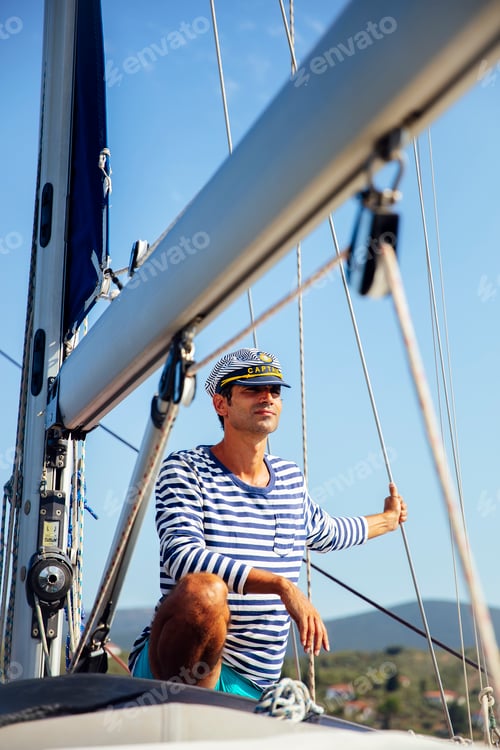 Preview: Handsome young man on a sailboat