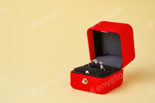 Preview: Golden ring in red jewelry box close up