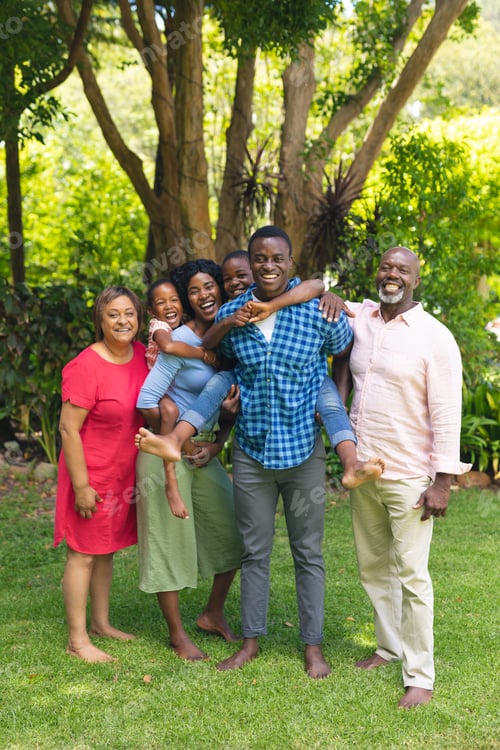 Vista previa: Portrait of happy african american multi-generational family spending weekend together