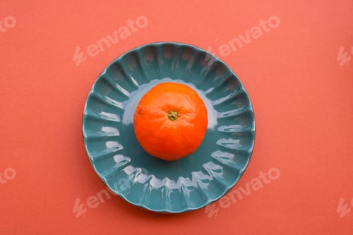Vibrant Clementine on Fluted Teal Plate Still Life
