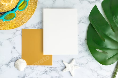 Preview: Blank white and gold paper card on marble table top view with summer beach