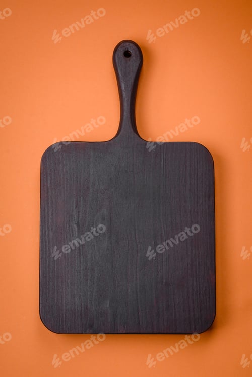 Preview: Empty wooden rectangular cutting board on a plain background, flatley with copy space