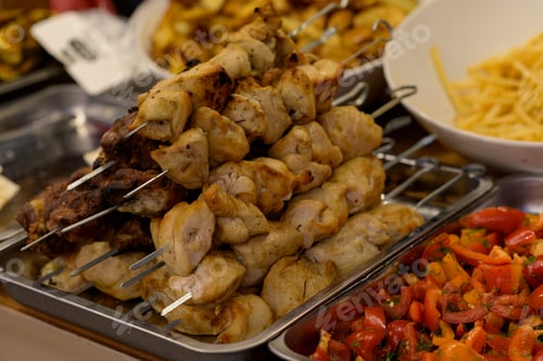 Preview: meat shish kebab on the grill. traditional outdoor barbecue picnic. grilled meat bbq