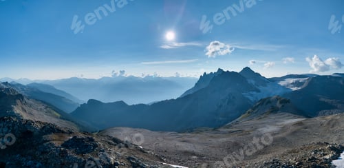 Preview: Scenic Alpine Landscape with Sunlit Mountains and Blue Sky in BC, Canada