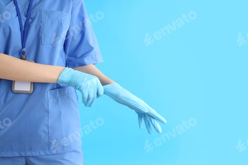 Preview: Healthcare Professional Putting On Medical Gloves