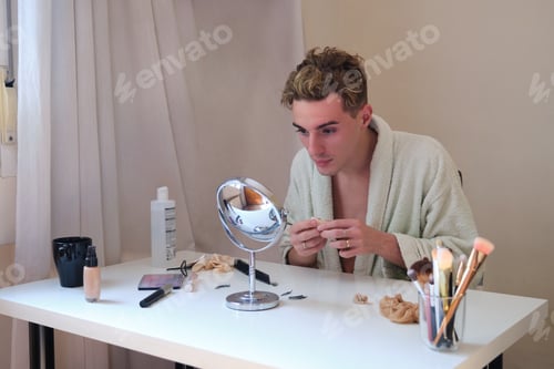 Preview: Drag queen person removing the make up and wearing bathrobe.