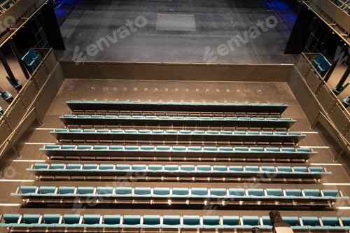 Preview: Photo Of An Empty Theatre Or Cinema Showing Rows Of Green Retractable Seats