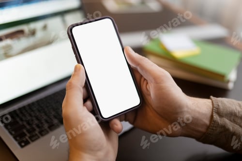 Preview: Man hand holding mobile phone using application shopping online, looking at blank display. Mockup