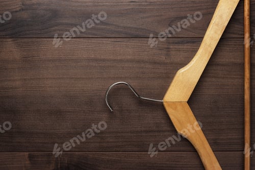 Preview: Wooden Hanger On a Dark Wood Background