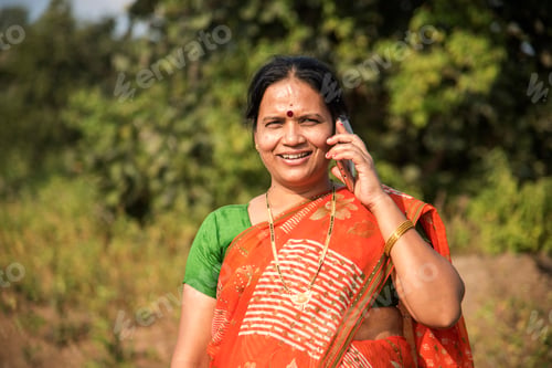 Preview: Indian woman talking on smartphone.