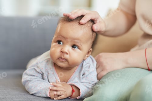 Preview: Mixed-Race Baby Lying on Sofa