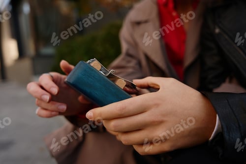 Preview: Close-up photo, a pocket mini-piano in the hands of young women